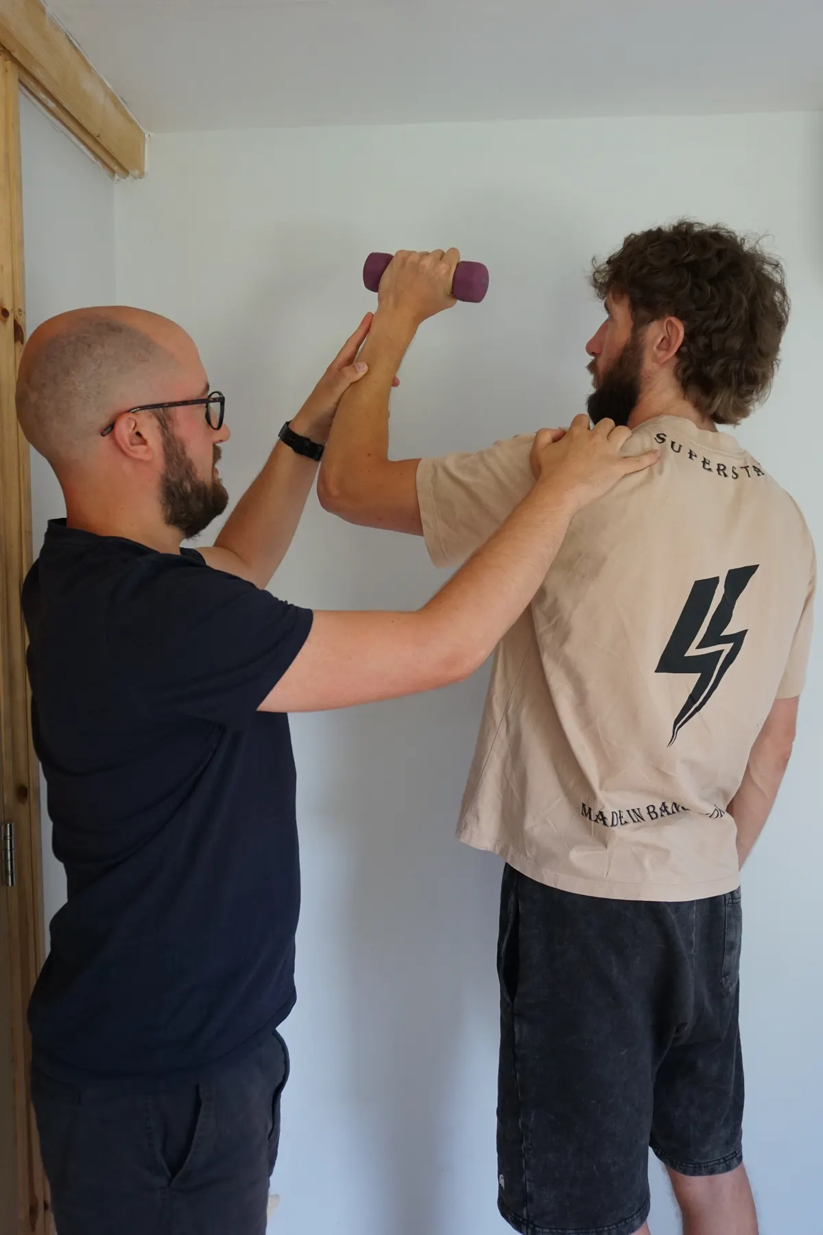 Rob guiding a client through a rehab exercise